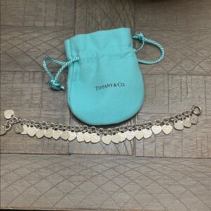 Tiffany & Co. Silver Heart Charm Bracelet with Blue Pouch. Barely worn.
